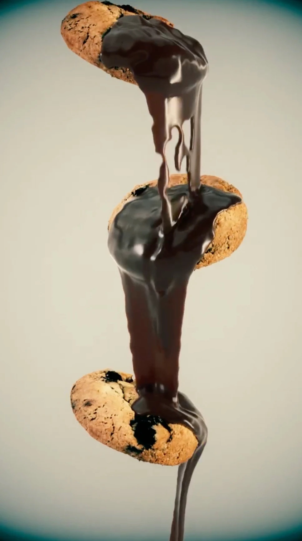 Melting chocolate dripping between three floating cookies, fluid simulation