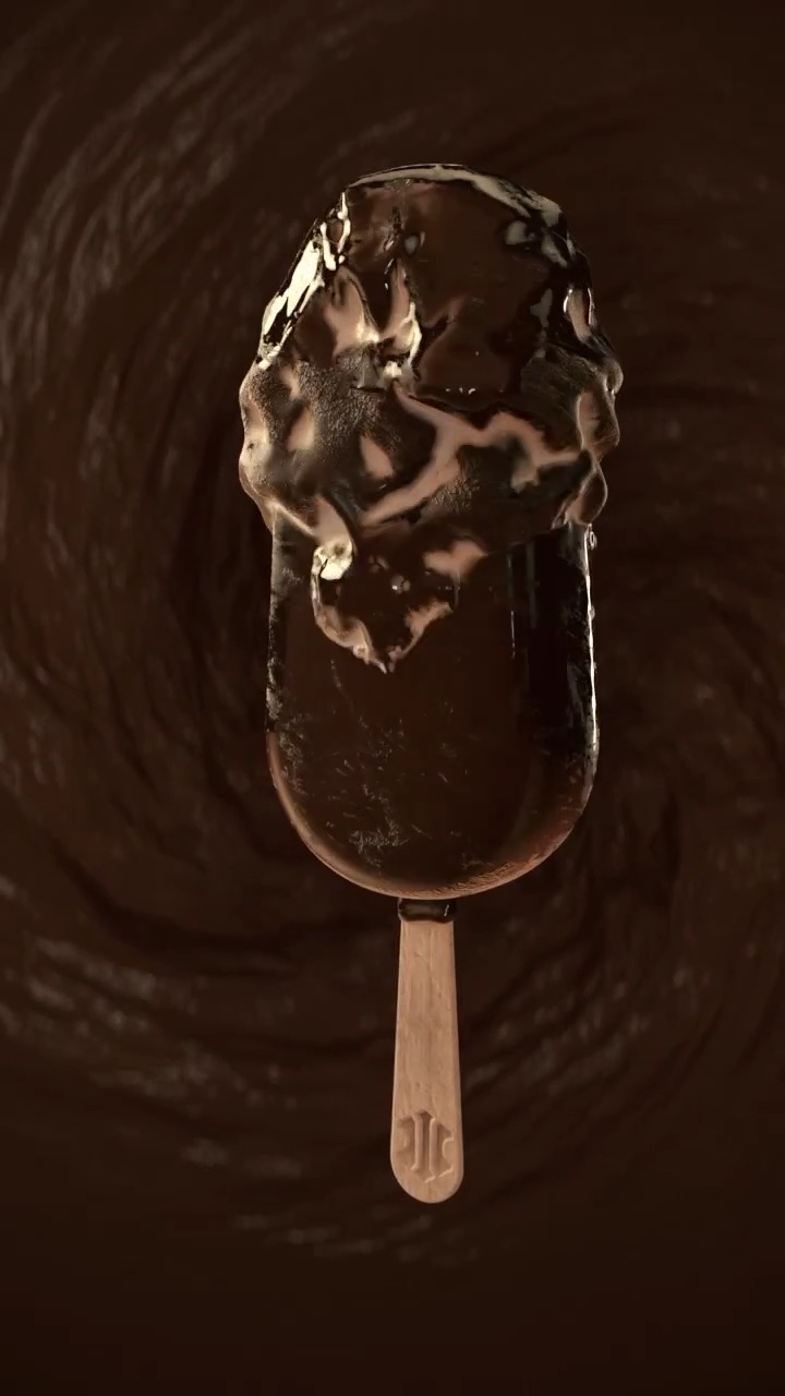 Ice cream bar seen from above, covered by a spreading, bulging layer of thick chocolate, a chocolate swirl in the background